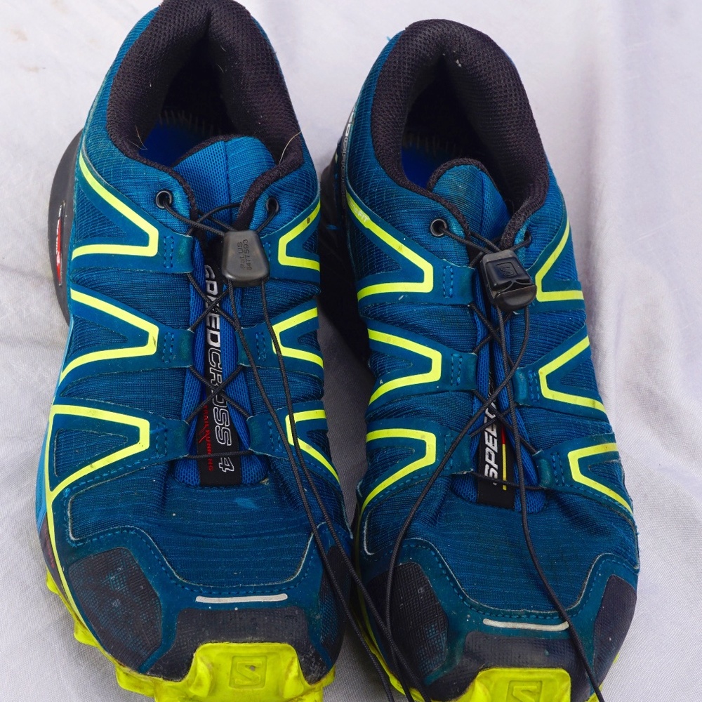 Mens Salomon running shoes. Slightly used. Some tread left. Look pretty new,.
